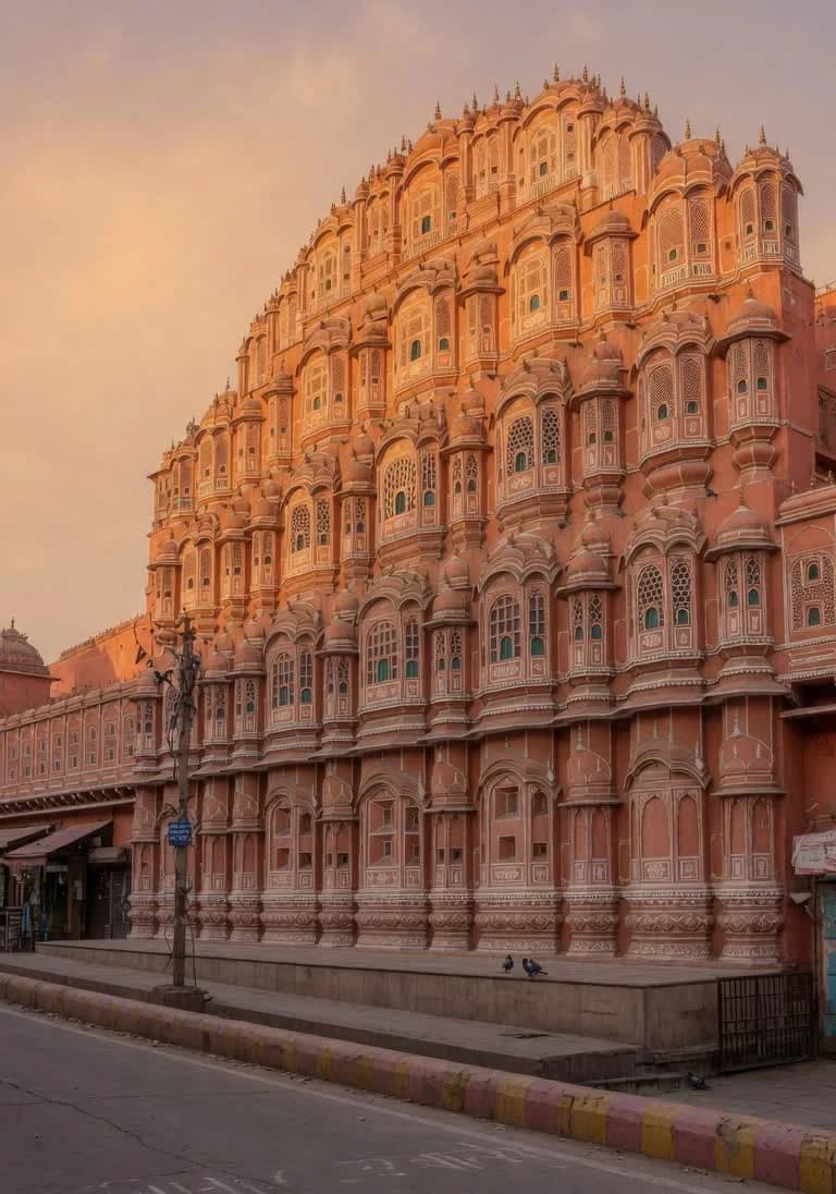 Hawa Mahal in Jaipur at late afternoon, pink sandstone facade in warm light